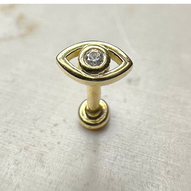 Yellow gold eye ear piercing with white zircons