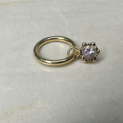 Yellow gold charm with precious stone