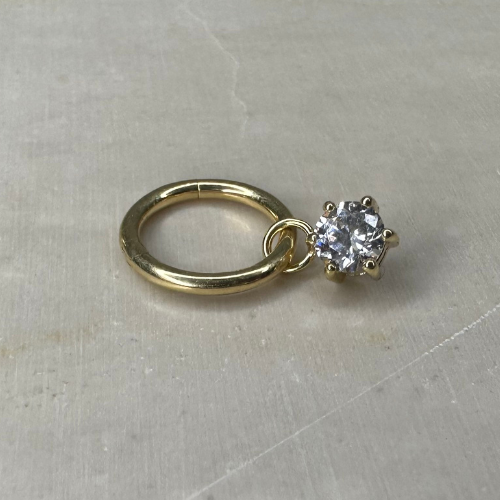 Yellow gold charm with clawed zirconium oxide