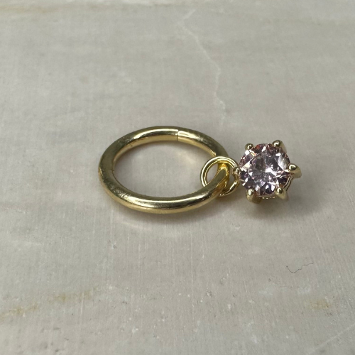 Yellow gold charm with clawed zirconium oxide