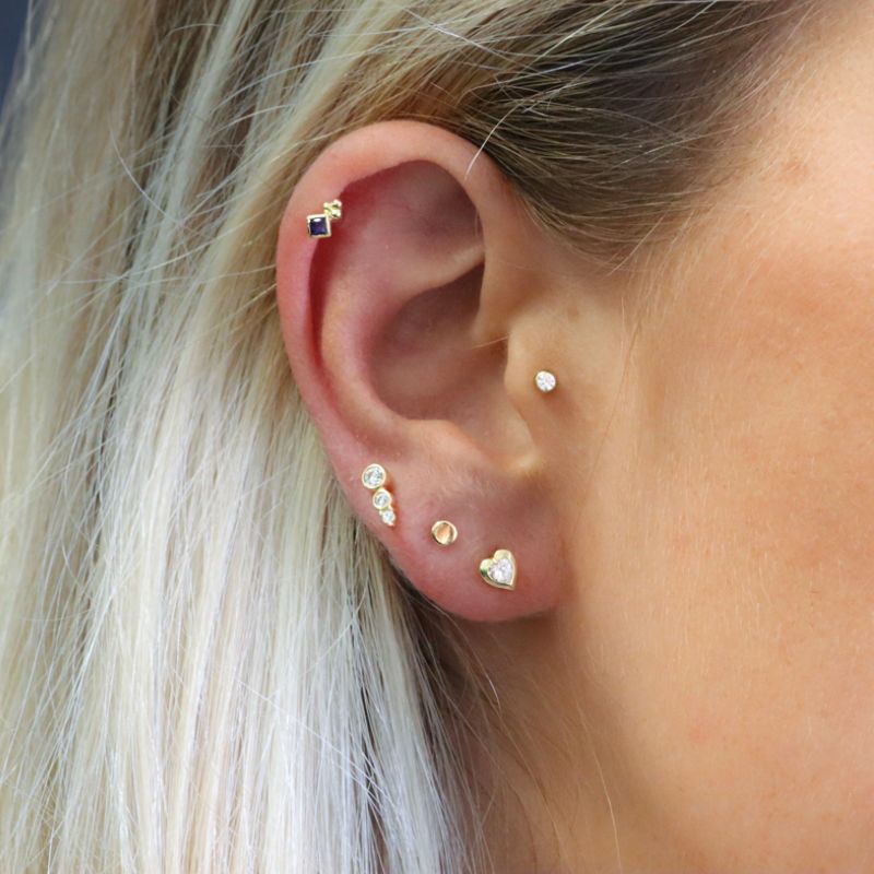 Yellow gold heart cartilage piercing with zircon