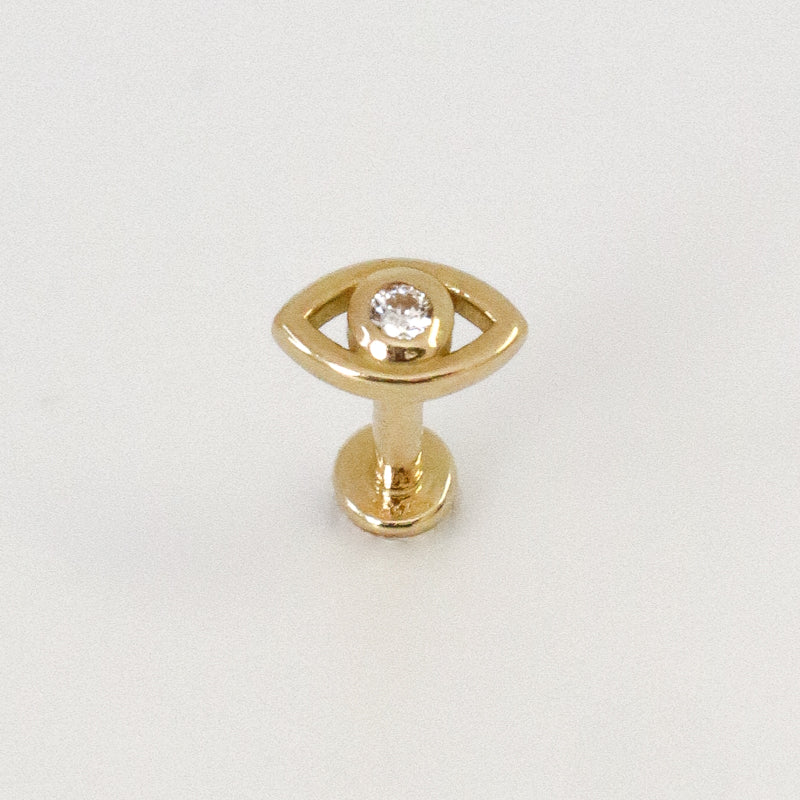 Yellow gold eye ear piercing with white zircons