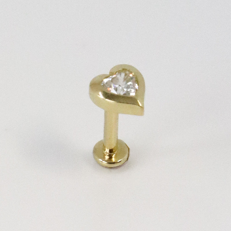 Yellow gold heart cartilage piercing with zircon