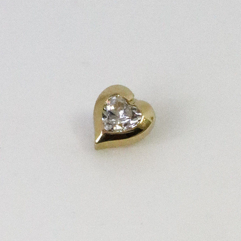 Yellow gold heart cartilage piercing with zircon
