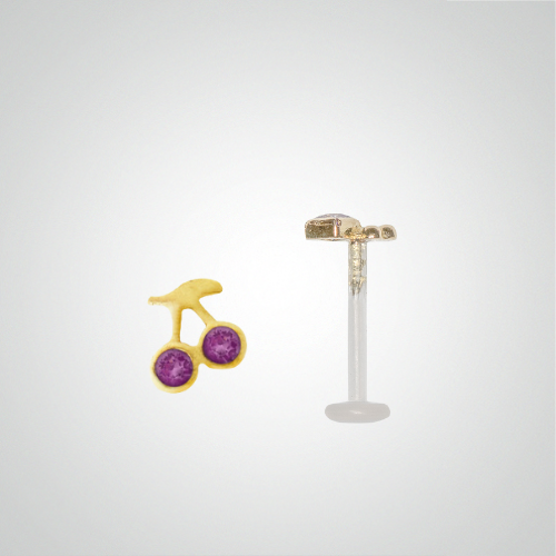 Cherry piercing with fuchsia zircons in yellow gold