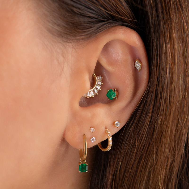Diamond ear piercing with zircon set in yellow gold