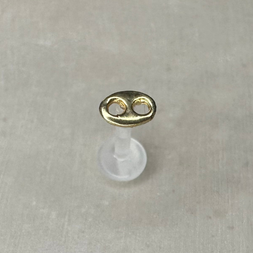 Yellow gold coffee bean piercing
