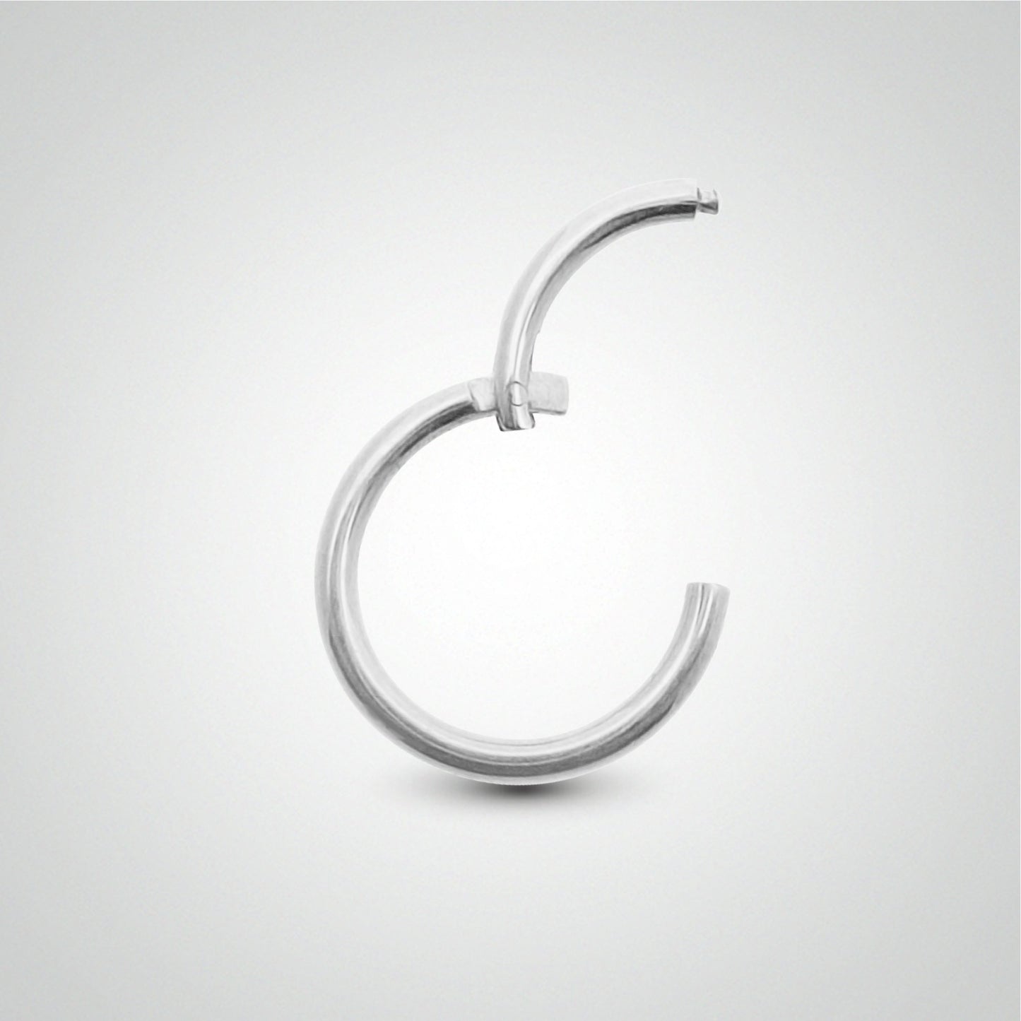 Piercing sexe anneau : clicker or blanc (pose manuelle, 1,6mm)