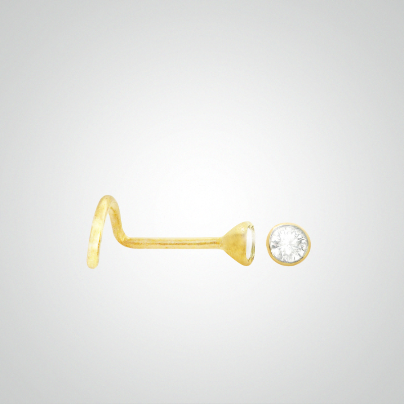 White zircon nose piercing set in yellow gold