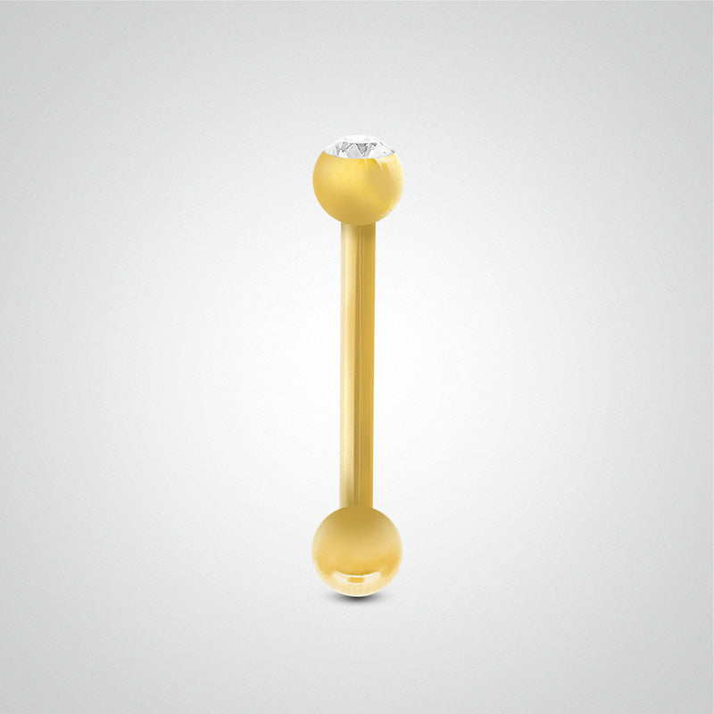 Yellow gold tongue piercing with balls and white zircon