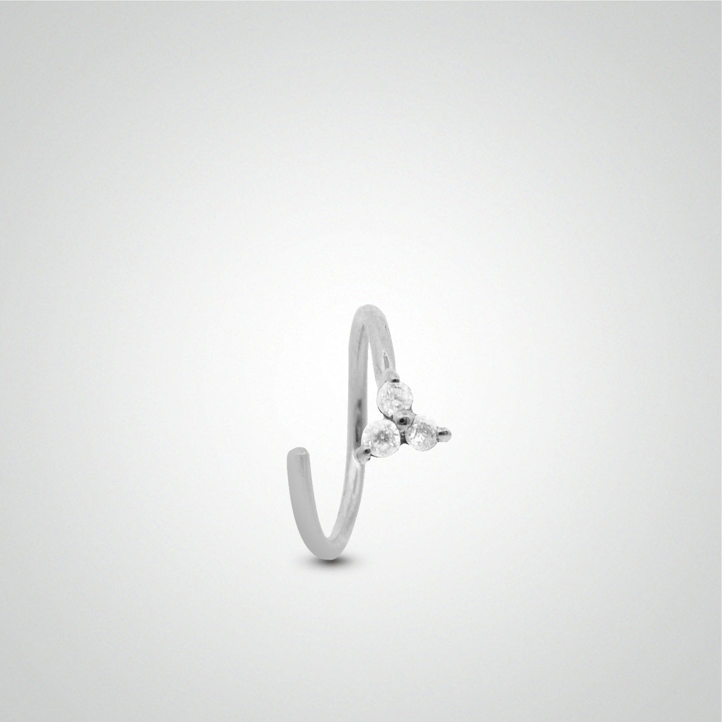 Tragus piercing: white gold ring to spread with zircon clover