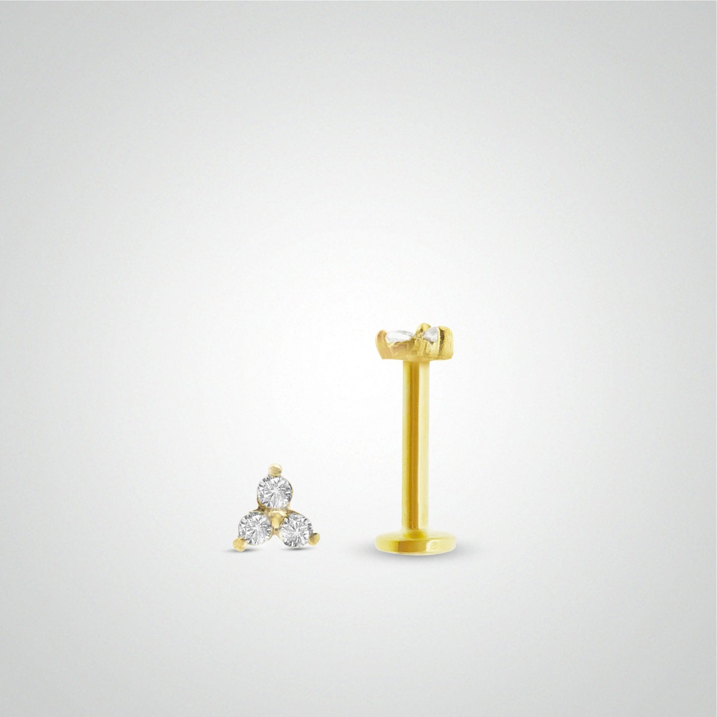 Boucle d'oreille or jaune avec trois zircons