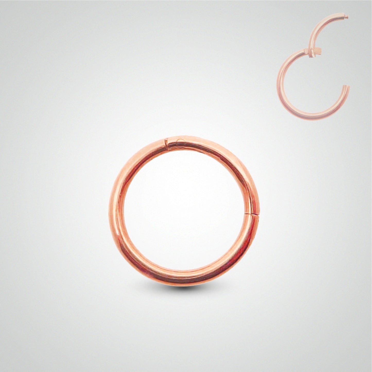 Rose gold clicker ring piercing, manual installation