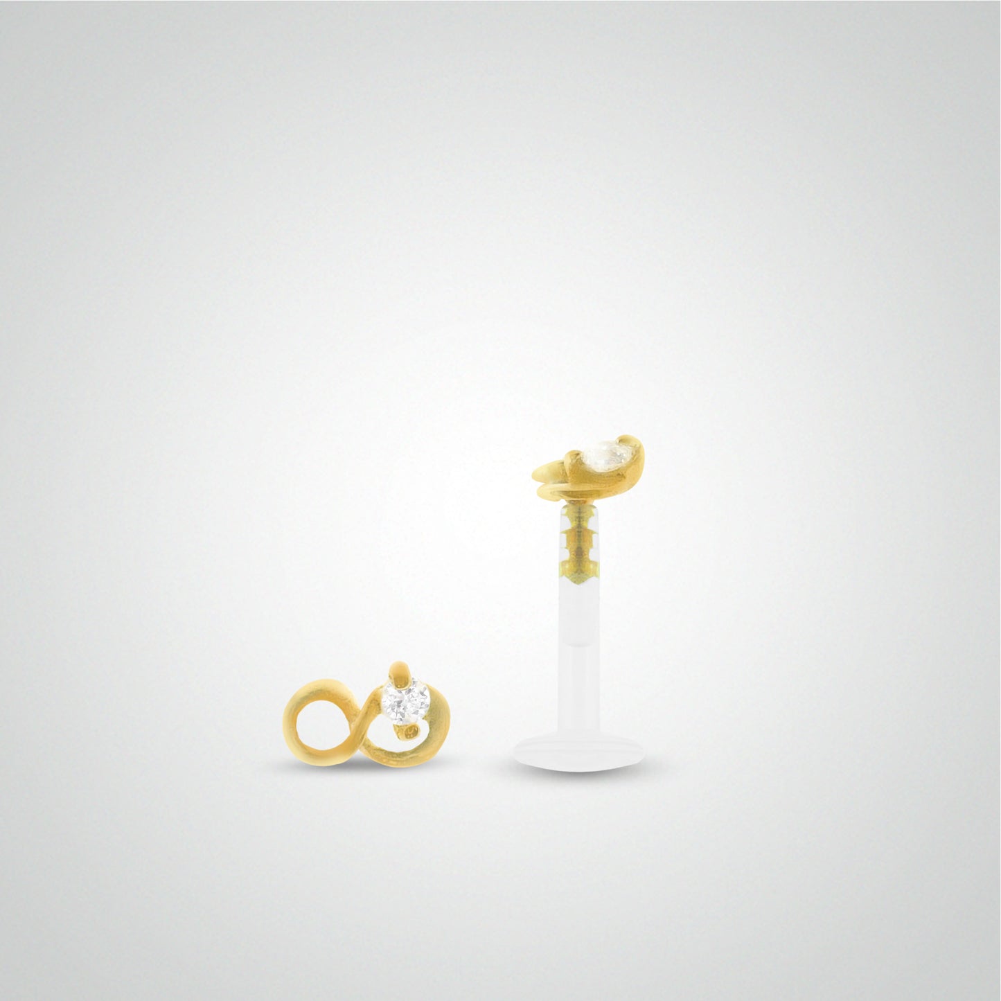 Yellow gold infinity antihelix piercing