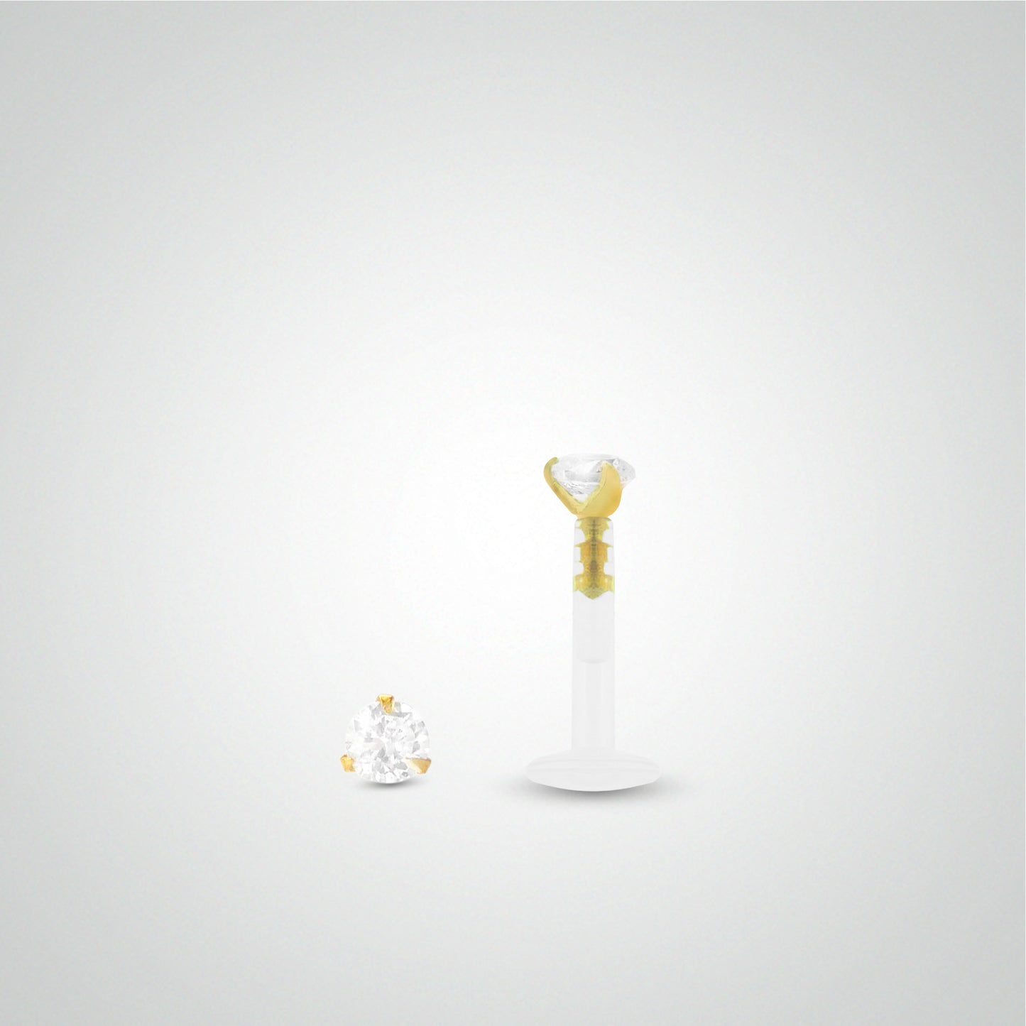 Yellow gold anti-helix piercing with zirconium oxide