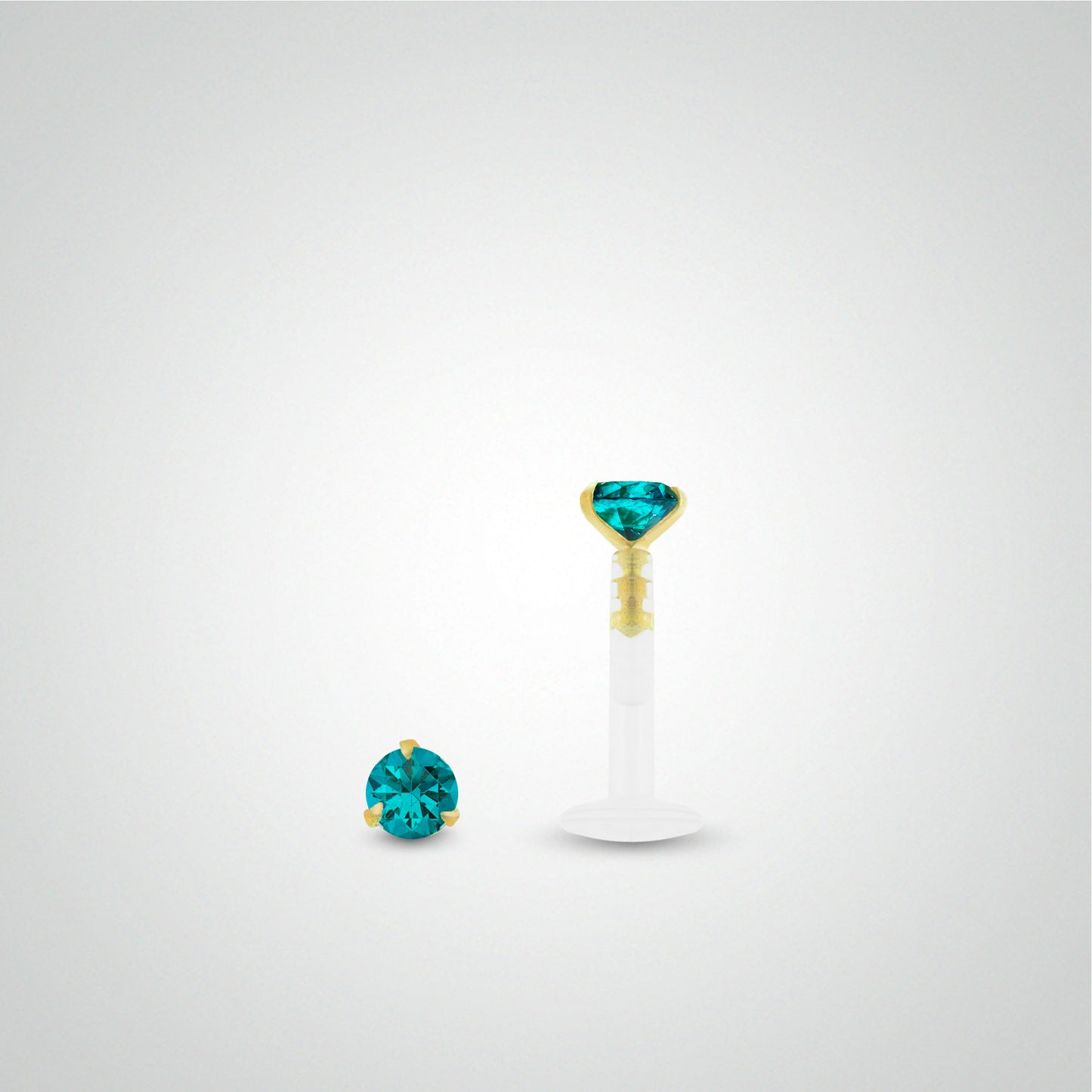 Yellow gold anti-helix piercing with turquoise zirconium oxide