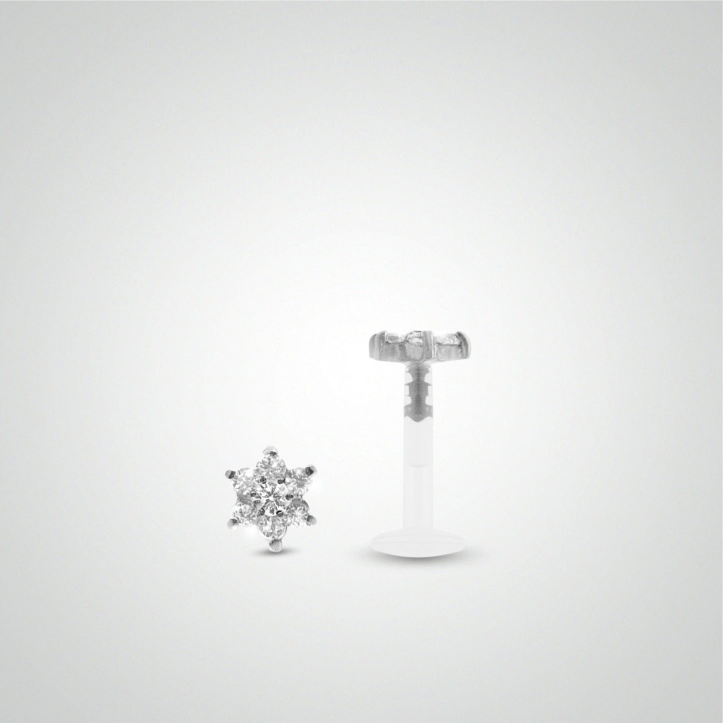 White gold helix piercing with white zirconium oxide flower