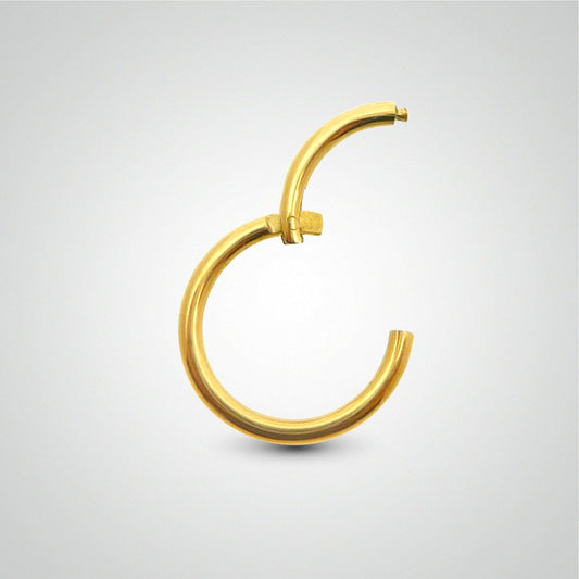 Piercing de conch : anneau clicker en or jaune (pose manuelle)