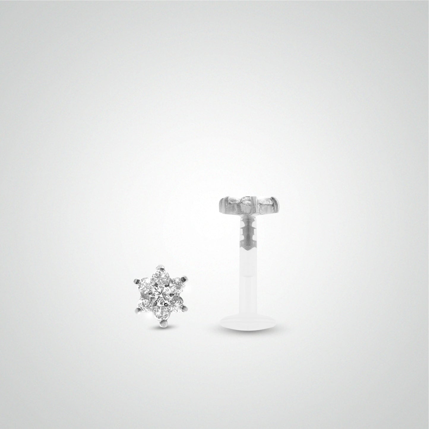 White gold conch piercing with white zirconium oxide flower
