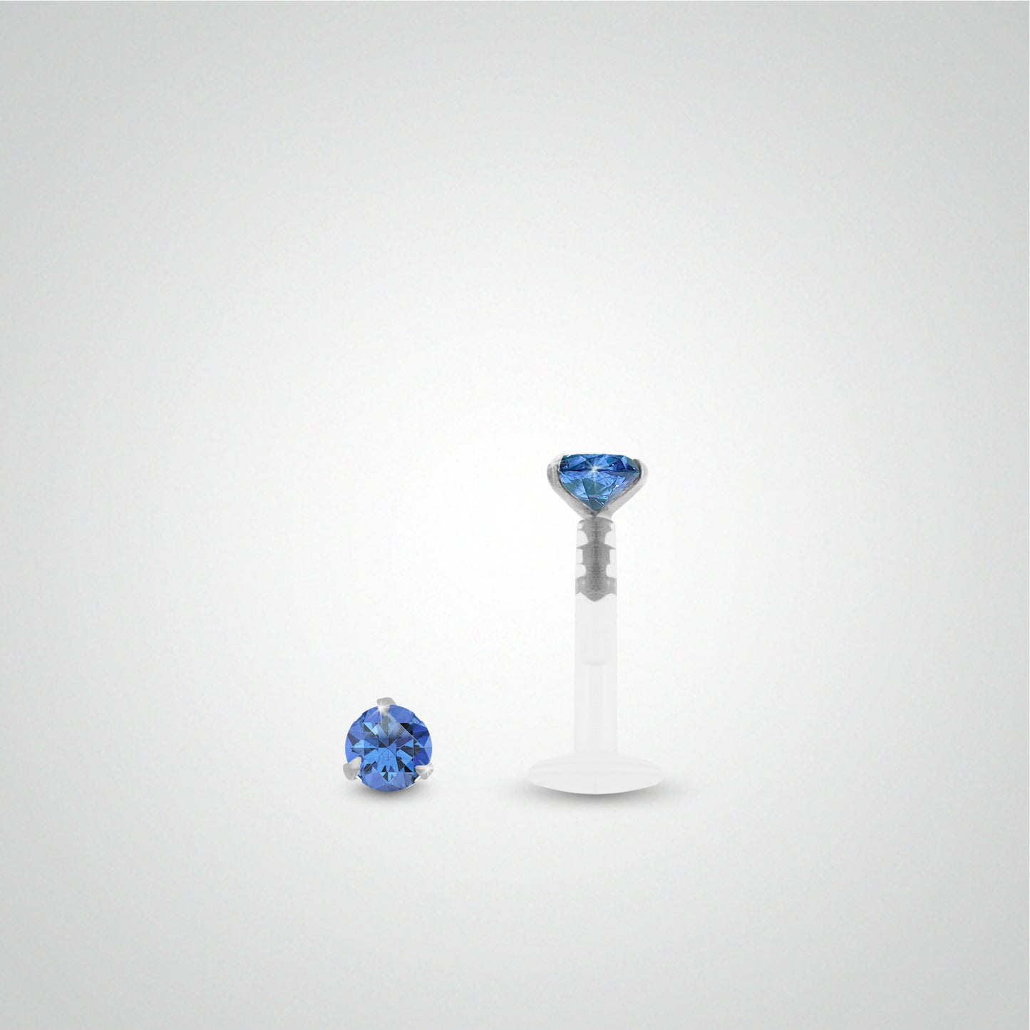 White gold conch piercing with dark blue zirconium oxide