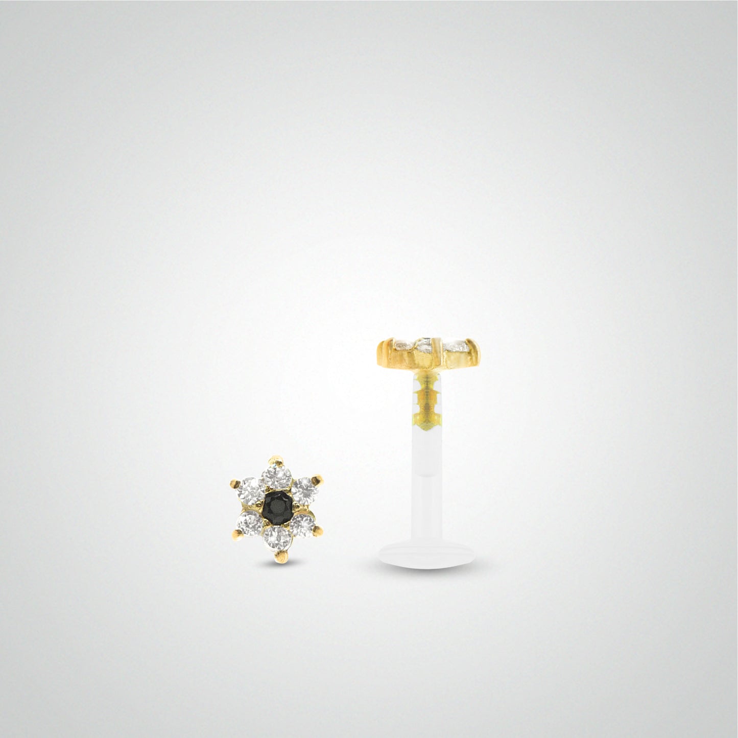 Yellow gold flower conch piercing