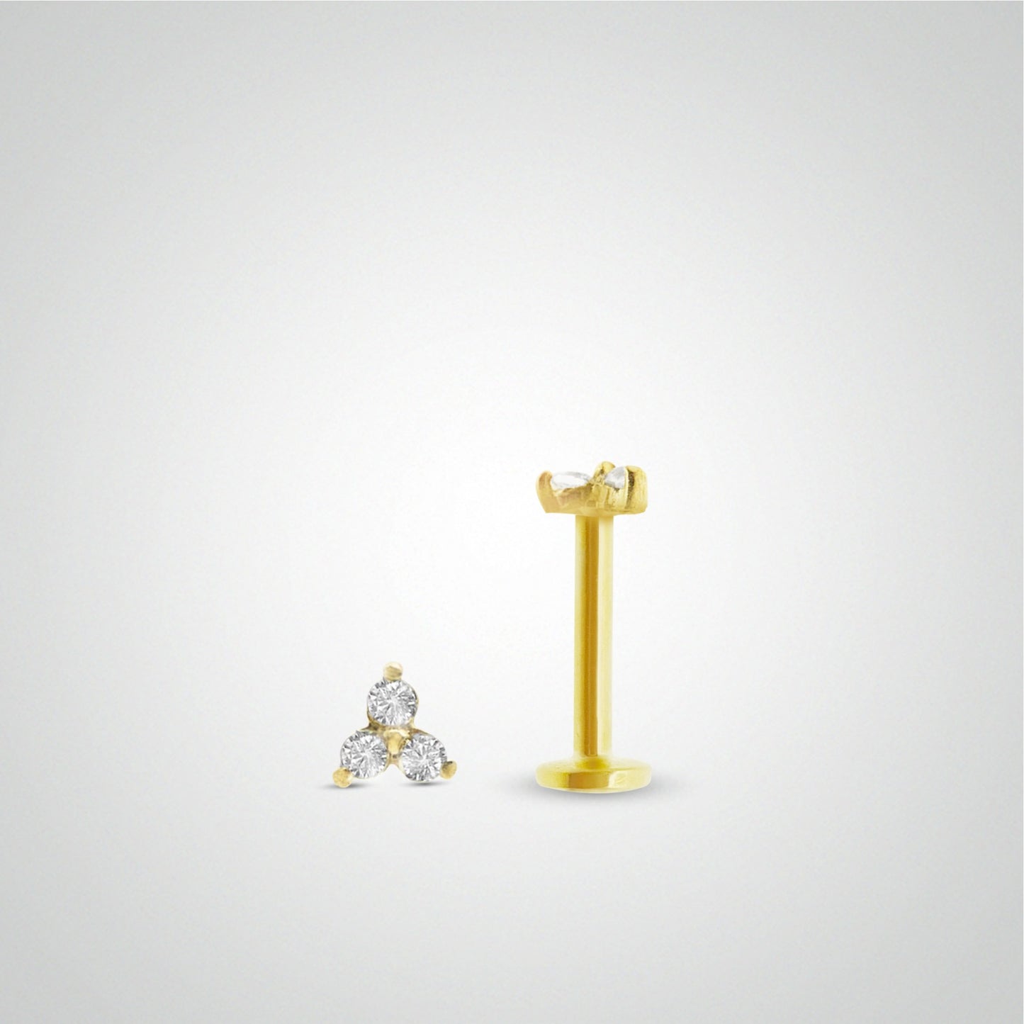 Yellow gold conch piercing with three zircons (screwable)