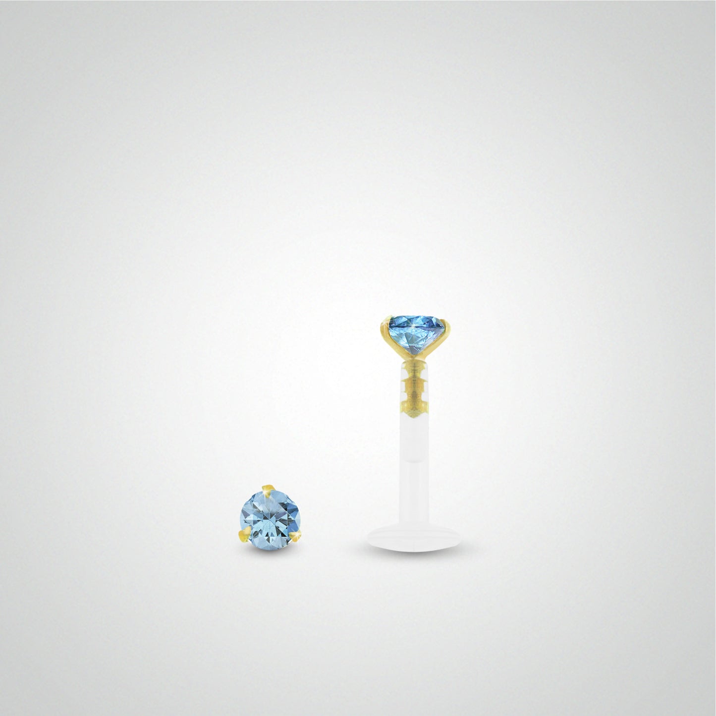 Piercing hélix or jaune avec oxyde de zirconium bleu clair