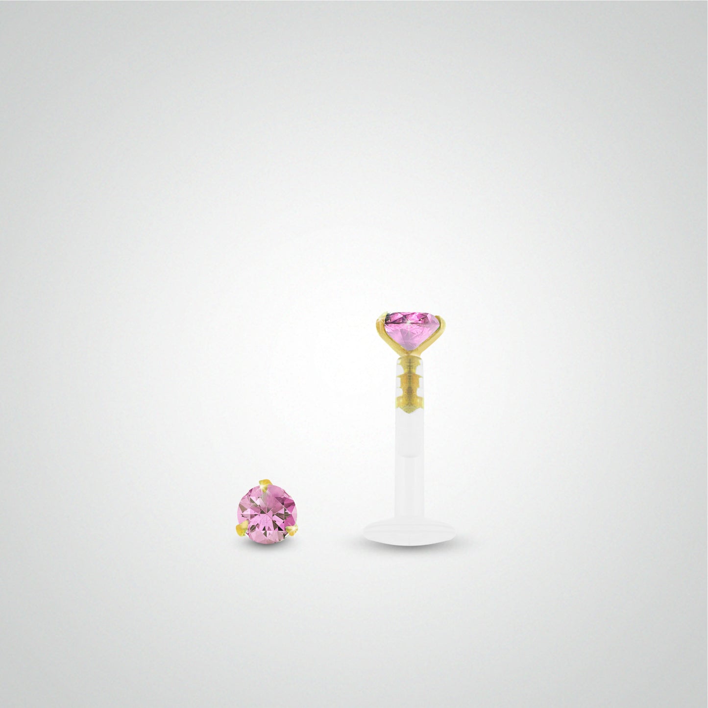 Yellow gold conch piercing with pink zirconium oxide