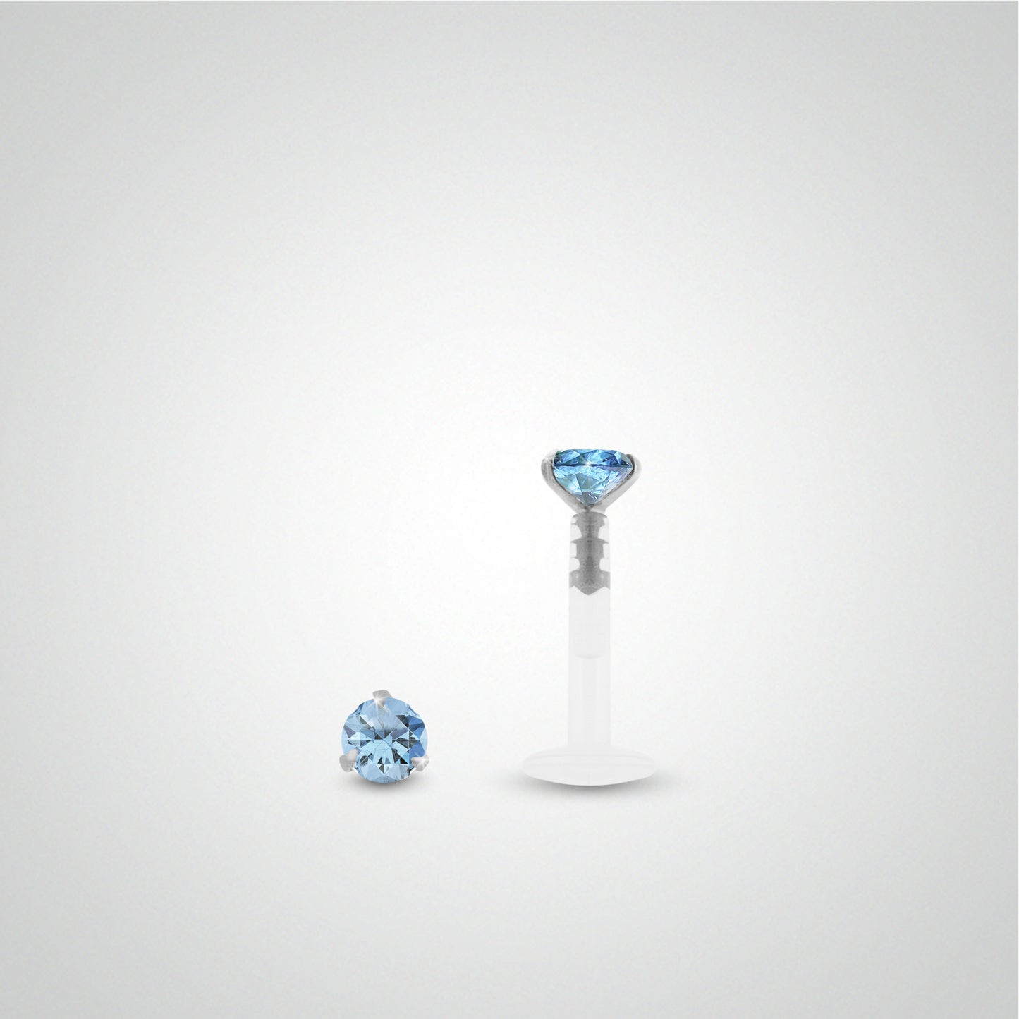 Piercing de bouche en or blanc avec zircon bleu clair