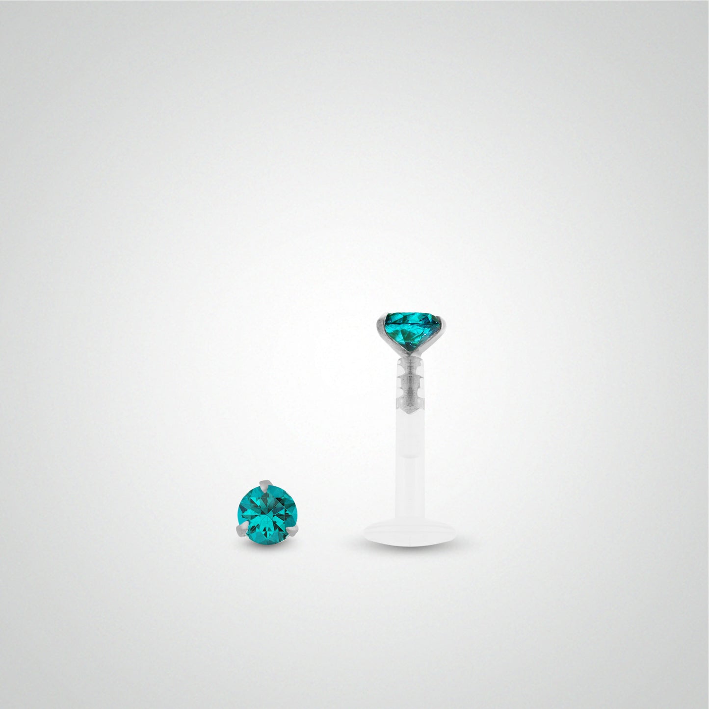 White gold labret piercing with turquoise zirconium oxide