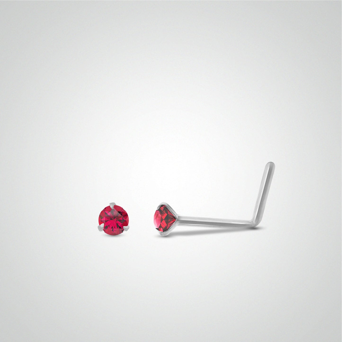 White gold ruby nose piercing