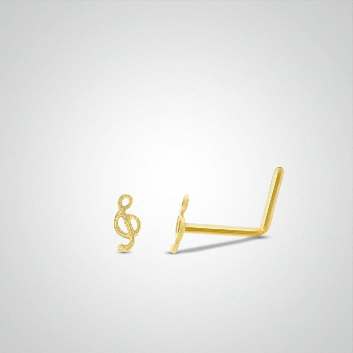 Yellow gold treble clef nose piercing