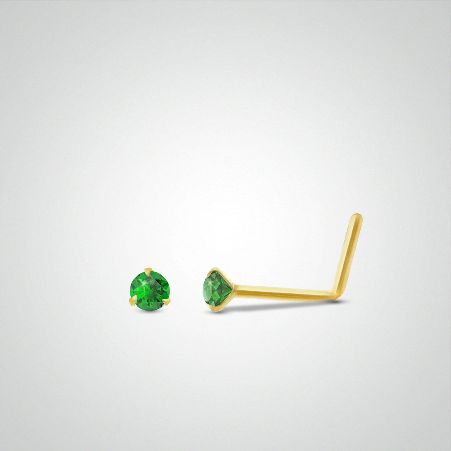 Yellow gold emerald nose piercing