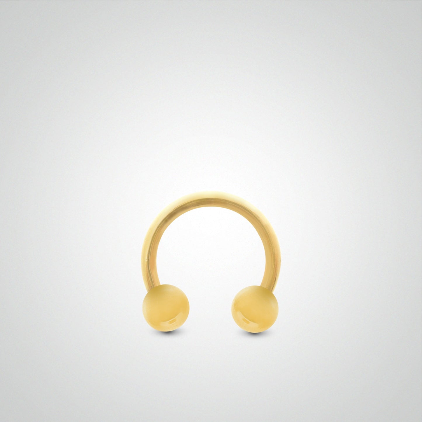 Yellow gold rook and daith piercing: horseshoe with balls (1.2mm)