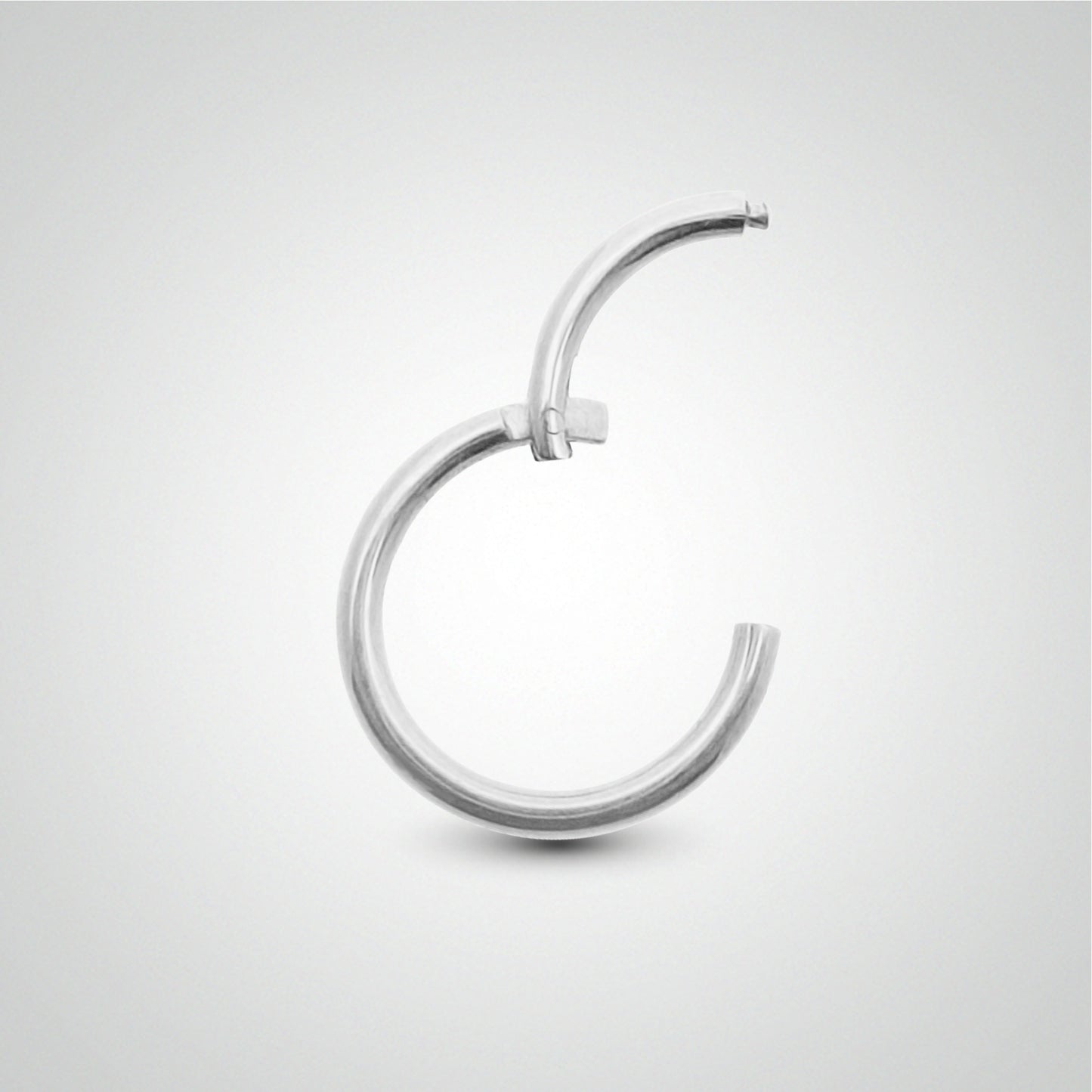 Piercing de sexe anneau clicker en or blanc pose manuelle(1,2mm)