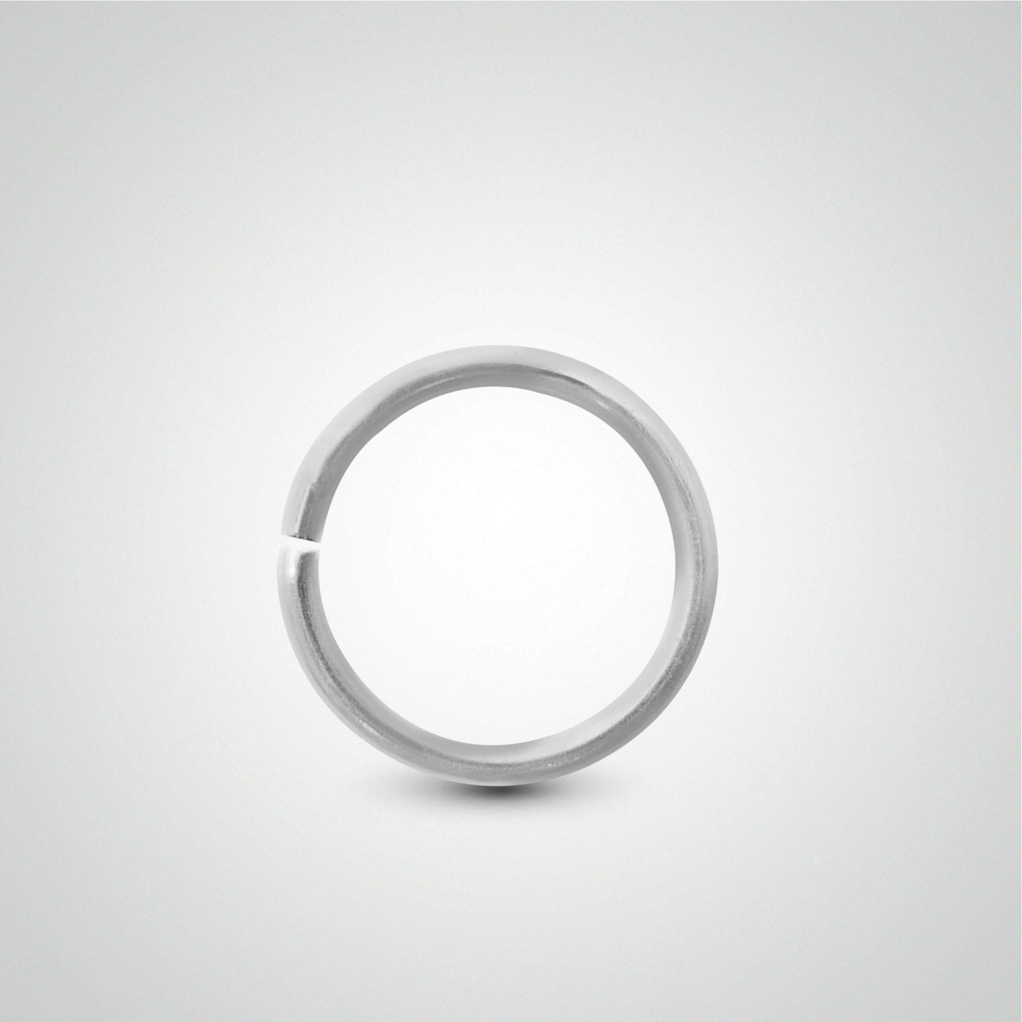 White gold tragus ring piercing to spread
