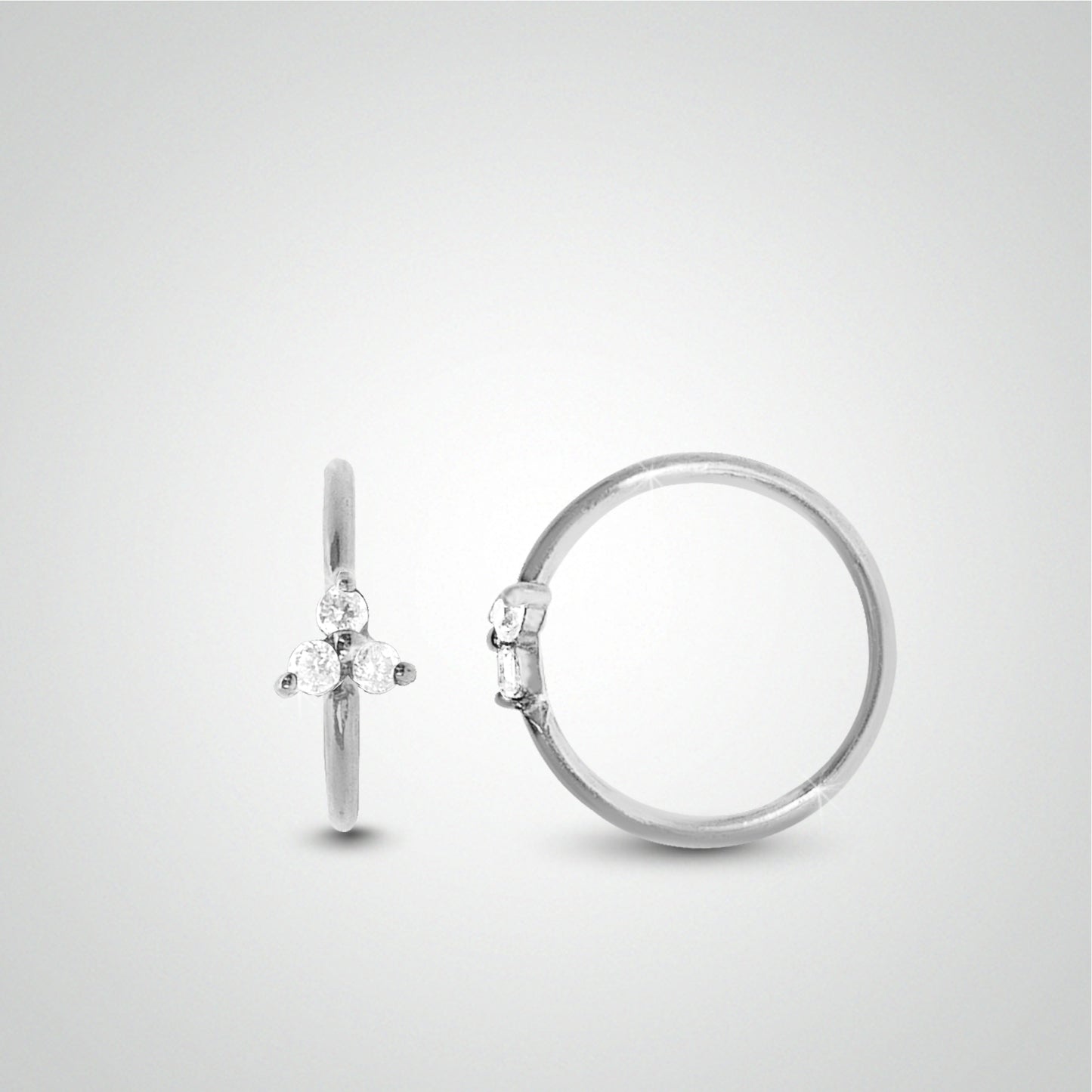 Tragus piercing: white gold ring to spread with zircon clover