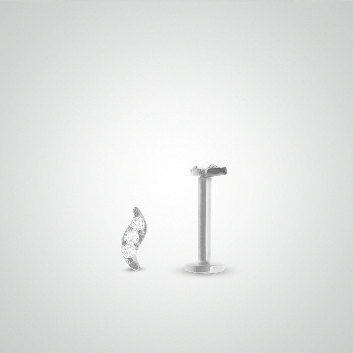 White gold leaf tragus piercing with three zircons (screwable)