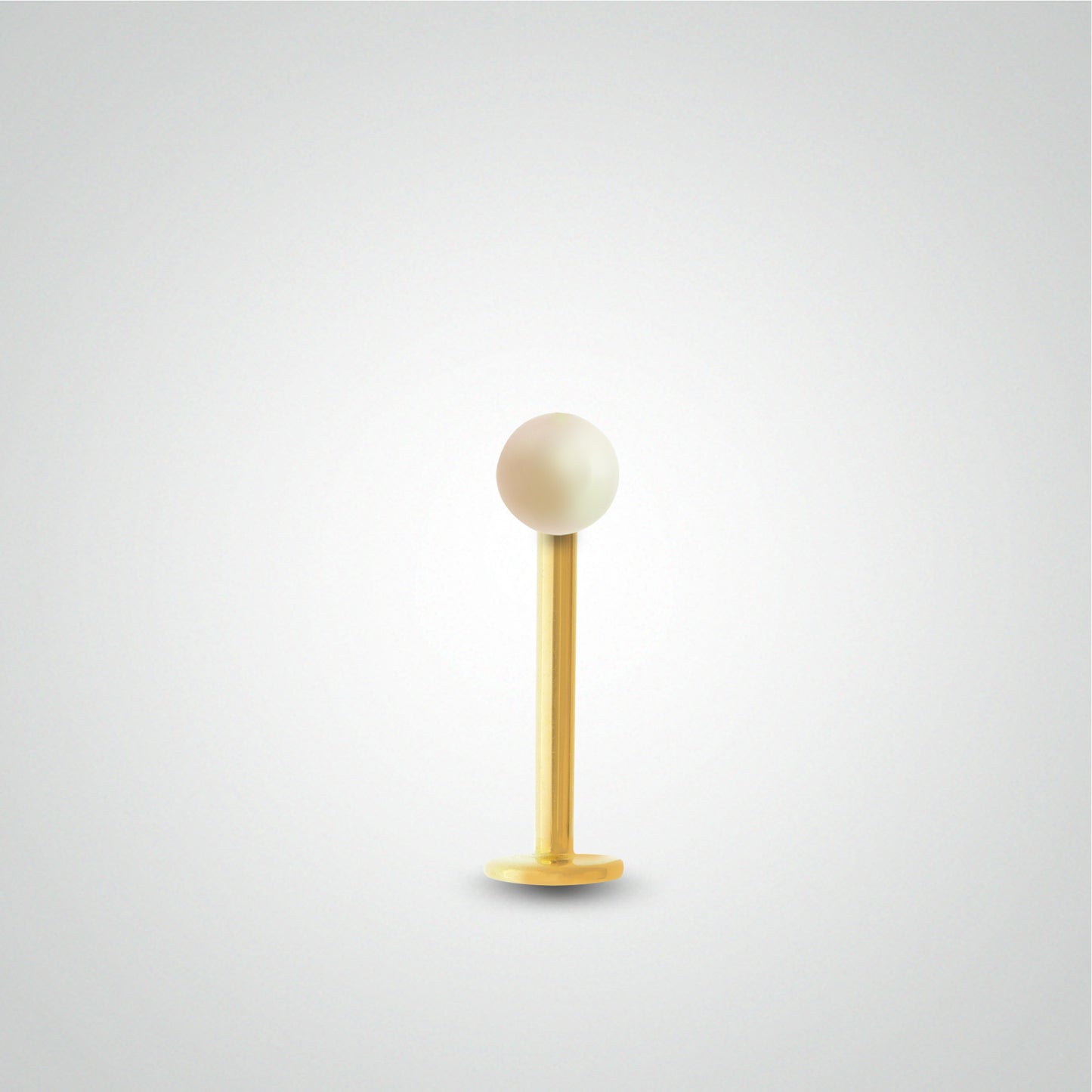 Yellow gold tragus piercing with genuine cultured pearl
