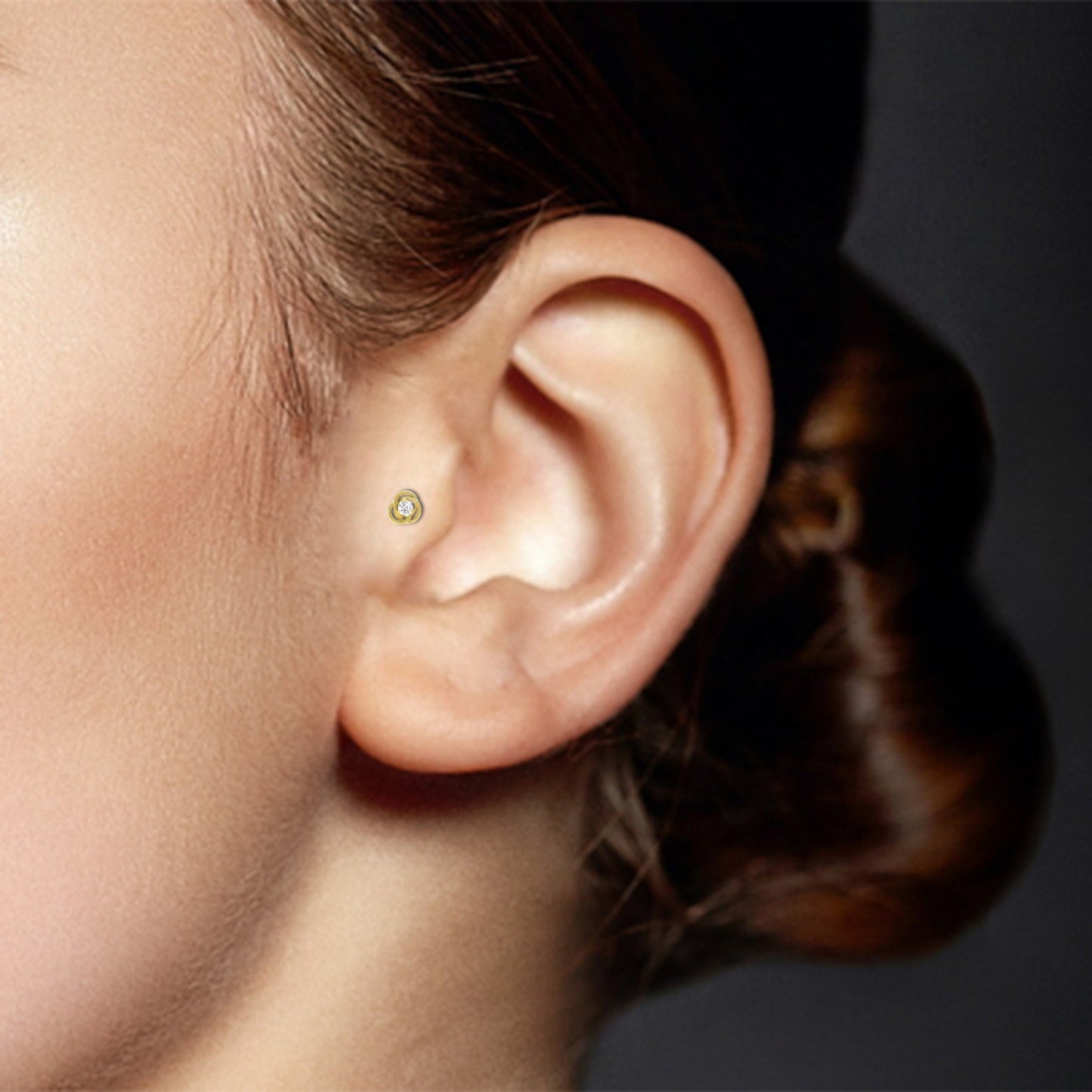 Yellow gold tragus piercing with rose and zirconium oxide (screwable)