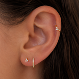 Yellow gold helix piercing with clover zircon