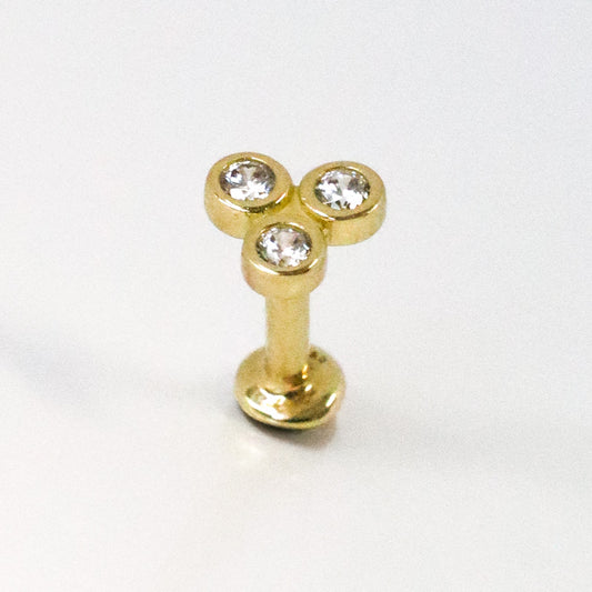 Piercing or jaune avec trois zircons blancs sertis