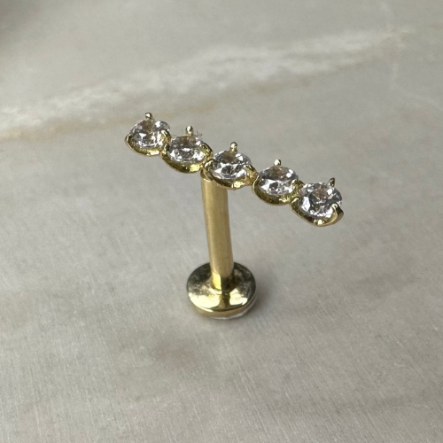 Piercing oreille en or jaune avec barrette de 5 zircons