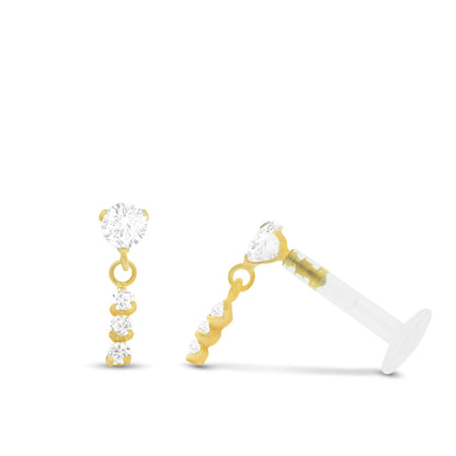 Piercing tragus en or jaune avec pendentif décoré d’une barrette de trois oxydes de zirconium brillants