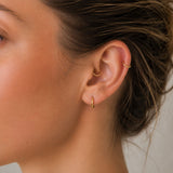 Piercing daith rook anneau clicker or jaune 18 carats pose manuelle