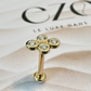 Piercing or jaune avec quatre zircons blancs sertis