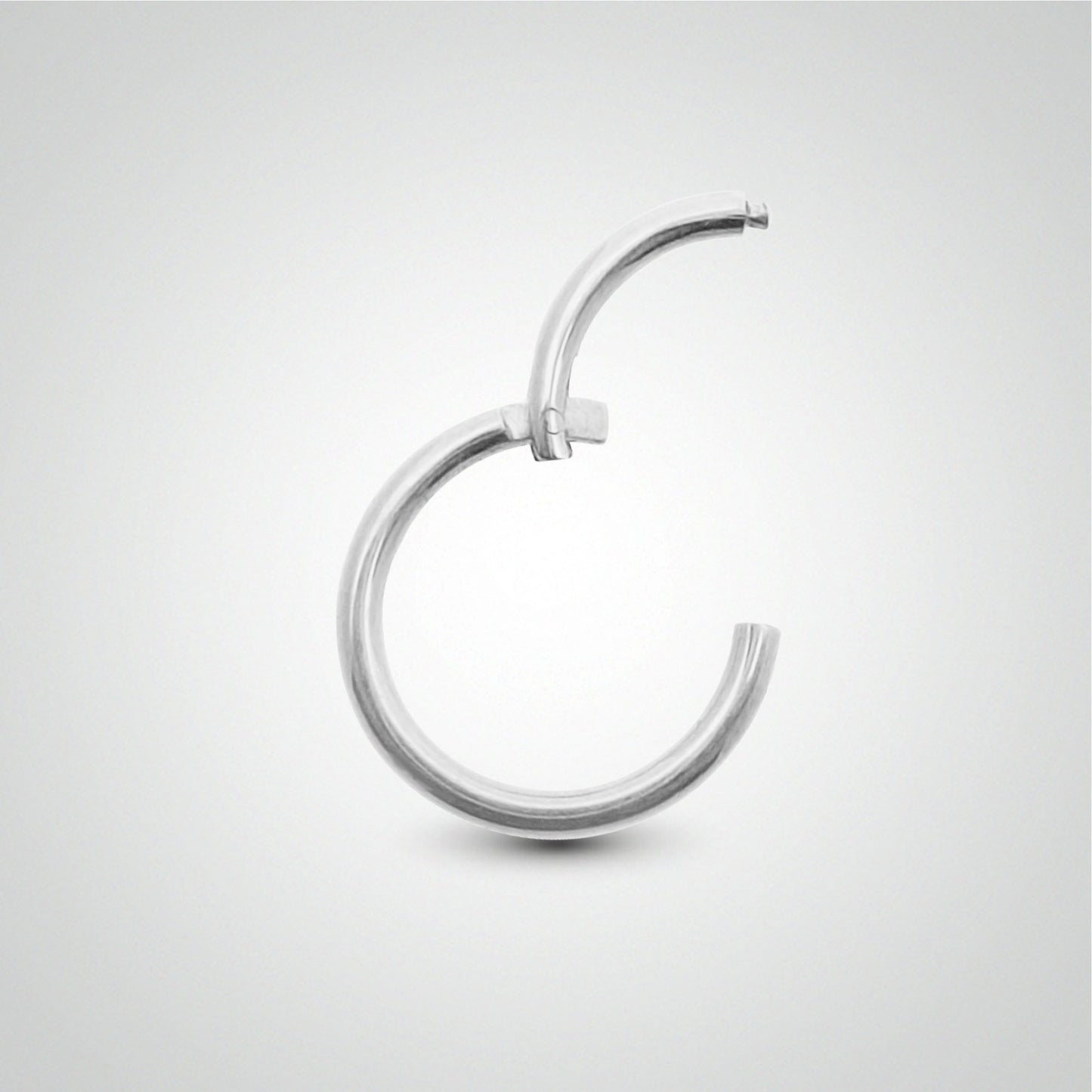 Piercing anneau clicker en or blanc pose manuelle (1,6mm)