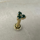 Screw-on yellow gold earring with three green zircons