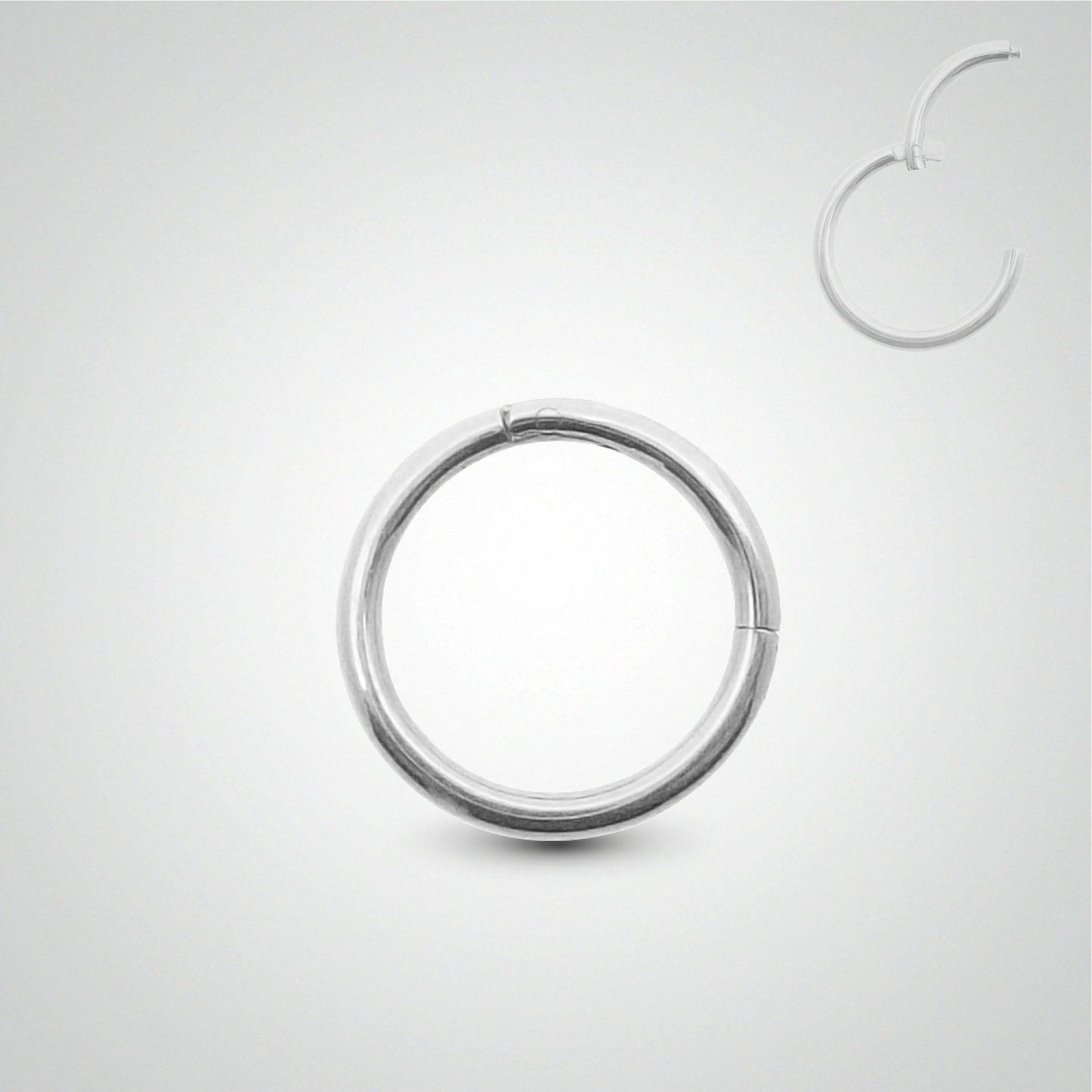 Piercing anneau clicker en or blanc pose manuelle (1,2mm)