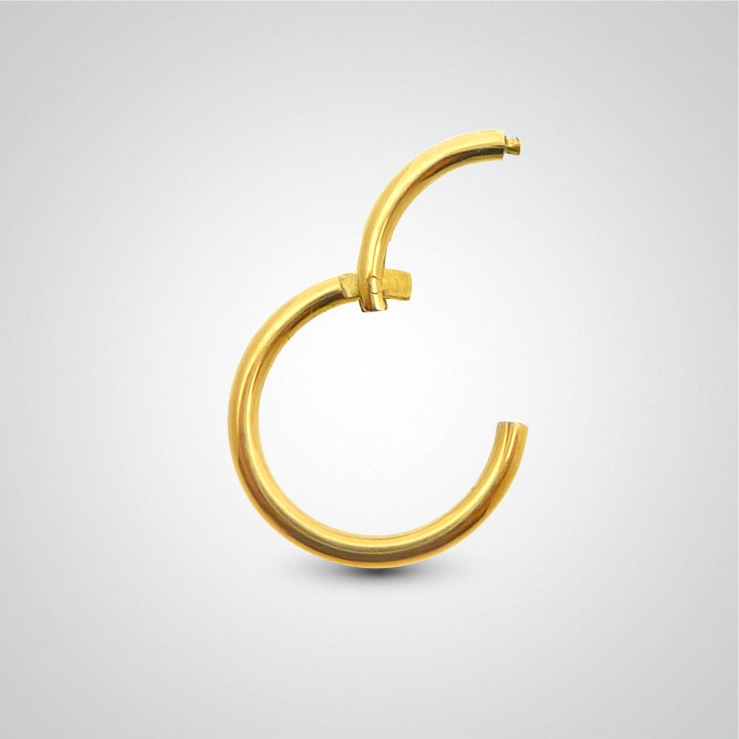 Piercing d'antihélix anneau clicker en or jaune (pose manuelle)